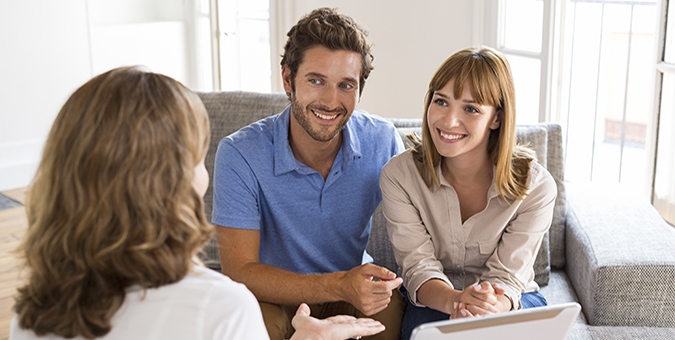 a couple meeting with a banker