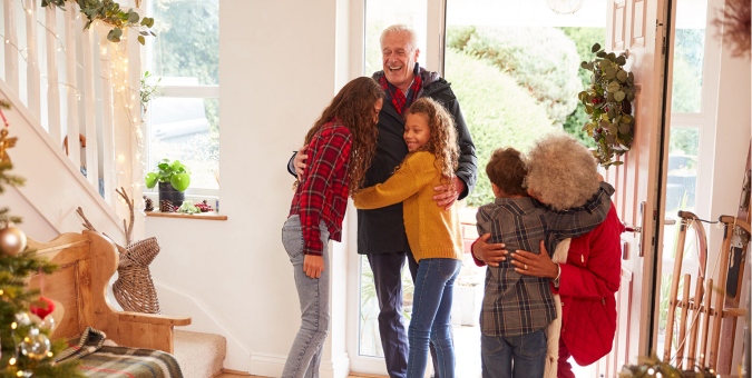 grandparent visiting grandkids for the holidays