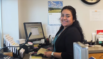 an SMB bank teller smiling