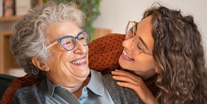 mother and daughter smiling